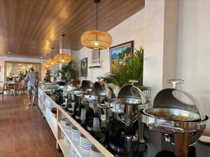 a buffet line with pots and pans on display at Sierra Hotel in Dumaguete