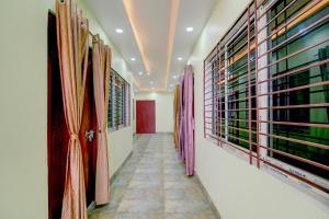 a hallway of a wine cellar with racks of wine bottles at SPOT ON RISA PALACE in Bhutiāgāon +60 photos