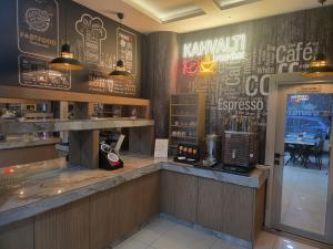 a restaurant with a bar with a counter and a counter at LOTUS OTEL in Konya