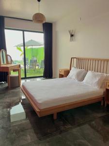 a bedroom with a large bed with a large window at Sapancamodern 2 in Sapanca +9 photos