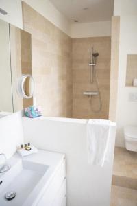 a bathroom with a shower with a sink and a toilet at Manoir la Meffrais 1741-Chambres d'hôtes à 3 min de Dinan-Parking Privé in Dinan +28 photos