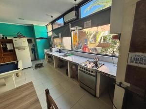 a kitchen with a sink and a counter top at Loft Salta in Bahía Blanca