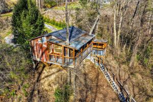 an aerial view of a house on a train track at Creekside Treehouse in Cosby