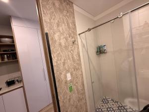 a shower with a glass door in a bathroom at Loft en Chapinero con todo lo que necesitas ! in Bogotá +34 photos