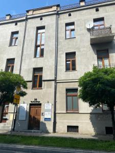 an apartment building with a balcony on the side of it at Stacja Centrum in Częstochowa