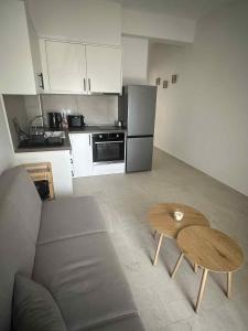 a living room with a couch and a table at Lemmy Аpartment in Ofrínion