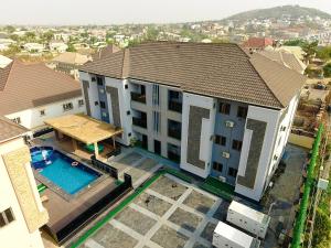 an overhead view of a house with a swimming pool at Macdestly Apartments in Abuja