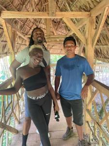 two men and a woman posing for a picture at BriBri AdvenTOURS in Tapantí