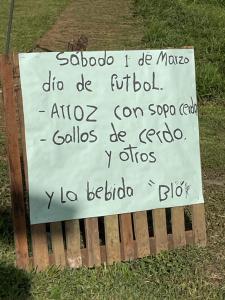 a sign on a bench with writing on it at BriBri AdvenTOURS in Tapantí
