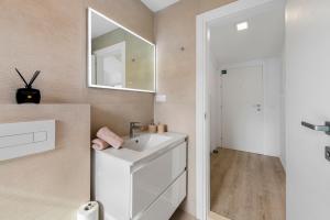 a bathroom with a sink and a mirror at Mirante in Mokošica +31 photos
