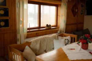 a living room with a table and a couch at Privat Luna in ľubeľa +63 photos