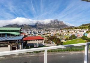 a view of a city with a mountain in the background at BKaap2 Queens and Kings Guest House in Cape Town
