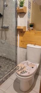 a bathroom with a toilet and a shower at Au 1894 Loft in Avize +33 photos