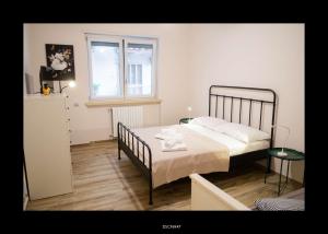 a bedroom with a bed and a window at Casa Porta D'Amalfi vicino Stazione e terminal Sita Salerno in Salerno