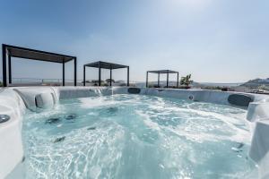 a jacuzzi tub on top of a building at Hotel Il Gabbiano in Bacoli