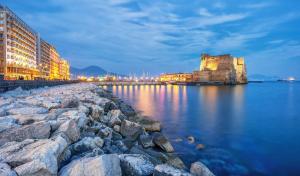 a view of a city with buildings and the water at Mellos B&B in Naples
