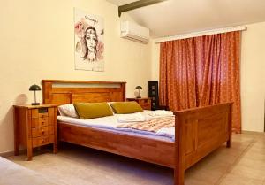 a bedroom with a large bed and a window at Къща за гости Арт Спектър in Bratsigovo
