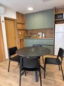 a kitchen with a table and chairs in a room at apartma Jelka in Novigrad Istria