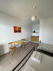 a living room with a table and a couch at Valentina Rooms in Qeparo +87 photos