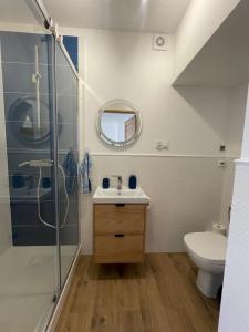 a bathroom with a shower and a sink and a toilet at Apartament JULIA in Głuszyca