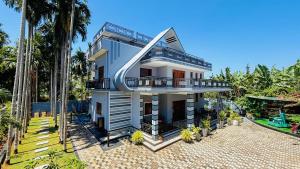 a rendering of a house with palm trees at Asmi Villa in Jaffna