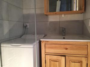 a small bathroom with a sink and a toilet at Charming mountain studio in Mont-Saxonnex