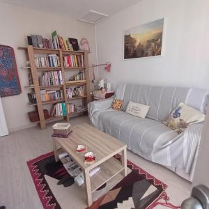 a living room with a couch and a coffee table at L'atelier d'LN in La Roque-dʼAnthéron
