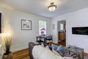 a living room with a couch and a table at Jolly Jefferson Ave Walk to the Best of Midtown in Memphis