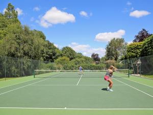two people playing tennis on a tennis court at Tuckenhay, Mill Leat - Fcv in Ashsprington