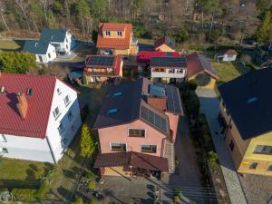 a group of houses with solar panels on their roofs at U Marysi i Jerzego in Żarnowska