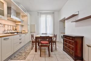 a kitchen with a table and chairs in a room at Venice Vacation in Marghera +15 photos