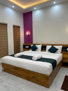 a bedroom with a large bed in a room at Neev holiday homes in Vythiri
