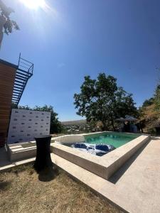 a swimming pool in the middle of a yard at Azat - Toon in Garni
