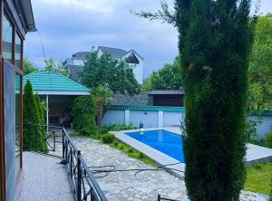 a house with a swimming pool in a yard at Qebele hot pool in Gabala