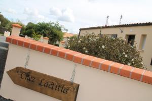 a sign hanging on the side of a building at chez laetitia proche du puy in La Flocellière