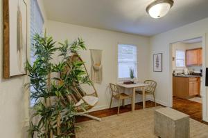 a living room with a table and a dining room at Gated Cottage Community! Ideal Midtown Spot in Memphis