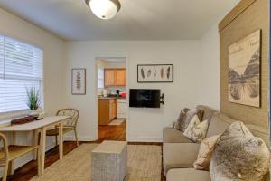 a living room with a couch and a table at Gated Cottage Community! Ideal Midtown Spot in Memphis