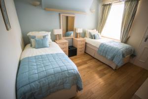 Postel nebo postele na pokoji v ubytování Atlantic Heights Guest House