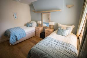 Postel nebo postele na pokoji v ubytování Atlantic Heights Guest House