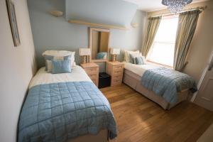 Postel nebo postele na pokoji v ubytování Atlantic Heights Guest House