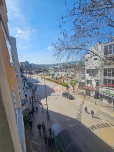 a group of people walking on a city street at Royal Konaklama Manzara in Bandırma