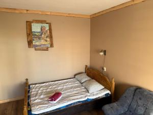 a bedroom with a bed and a picture on the wall at 1-bedroom 2 big beds MV64 in Tartu