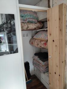 a room with several pillows on a shelf at Stay in Annascaul Village at Aido's in Anascaul