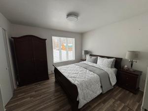a bedroom with a large bed and a window at Finca Saddiki in Namur