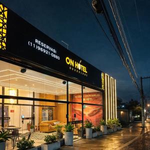a building with a sign on the side of it at On Park Hotel e Traslado in Guarulhos
