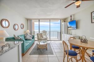 a living room with a couch and a table at Carolina Reef #705 in Myrtle Beach