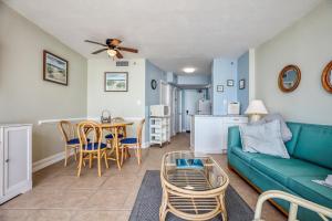 a living room with a couch and a table at Carolina Reef #705 in Myrtle Beach