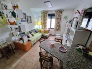 a living room with a couch and a table at Adro Redondela in Redondela