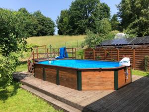 a pool in a deck with a gazebo at Noclegi Bajama in Siepraw