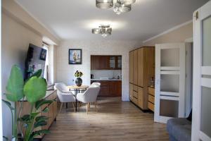 a kitchen and dining room with a table and chairs at U Marysi i Jerzego in Żarnowska